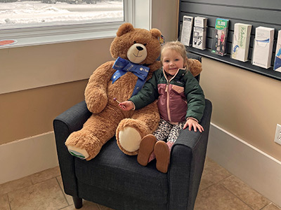 Charlie with Large Stuffed Teddy Bear