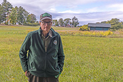 Peter Paine standing in a field near his home.
