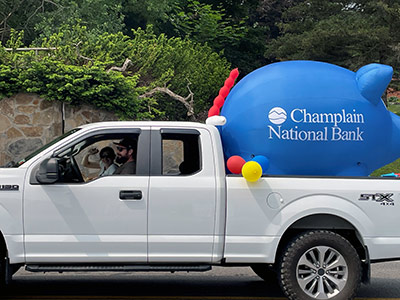 Truck with Inflatable Piggy Bank in Back