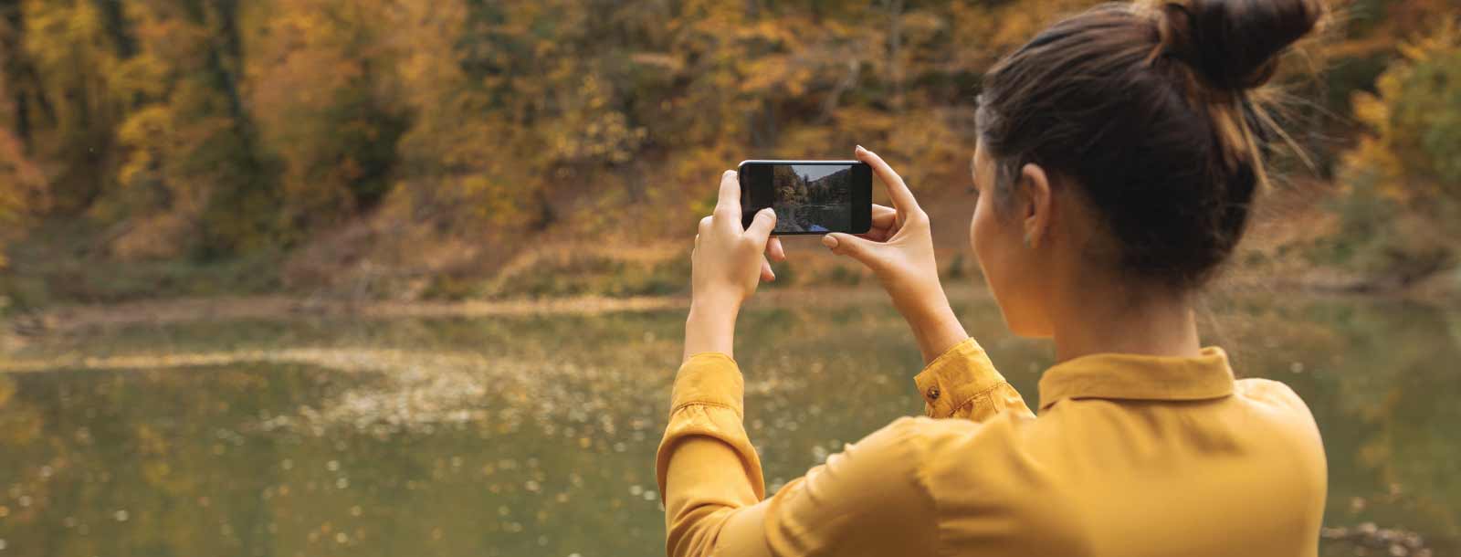 Woman Taking a Photo with Mobile Phone