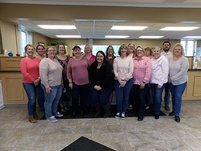 Willsboro Employees Wearing Tops and Jeans