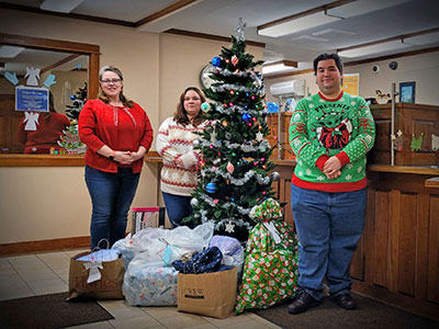 Keene Employees Wearing Holiday Sweaters