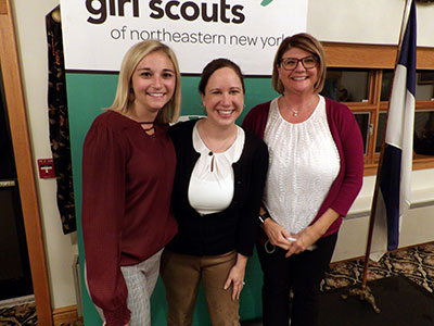 Taylor Jackie and Lori Posing in Front of Girl Scout Sign