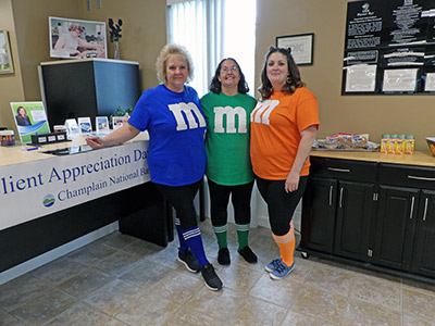 Three Girls Wearing M and M T-Shirts