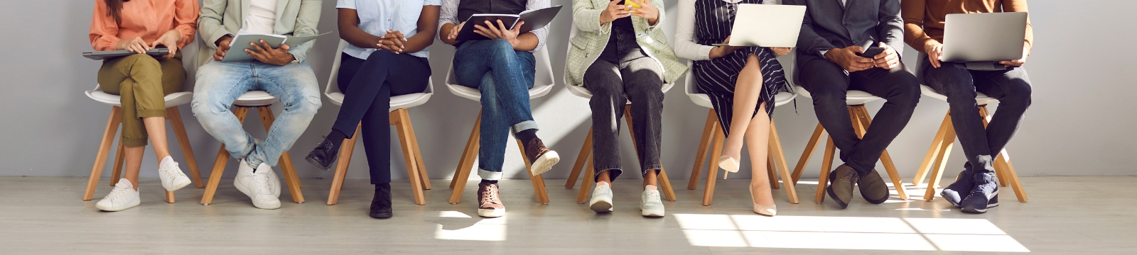 Young Business People Sitting at Conference Table