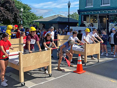 People Wearing Hard Hats Getting Ready to Push Beds