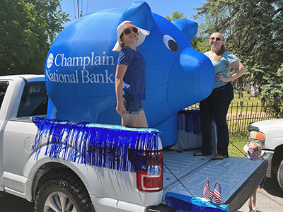 Autumn and Kurri Standing in Truck Bed with Inflatable Pig