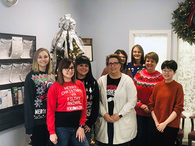 Plattsburgh Downtown Employees Wearing Holiday Sweaters