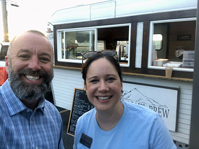 Mike Foote and Jackie Hallock standing in front of High Peaks Brew Trailer
