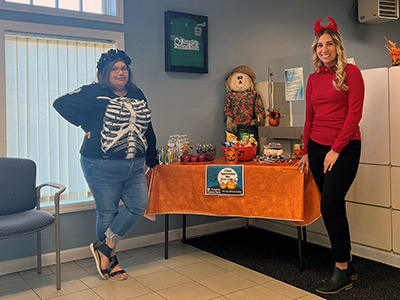 One Girl Wearing Skeleton Costume and One Girl Wearing Devil Costume