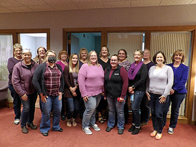 Willsboro Employees Wearing Tops and Jeans