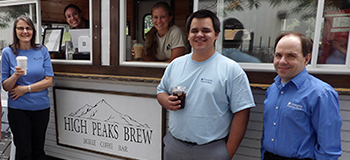 Laurie, Vinny, and Todd Standing in Front of High Peaks Brew Trailer