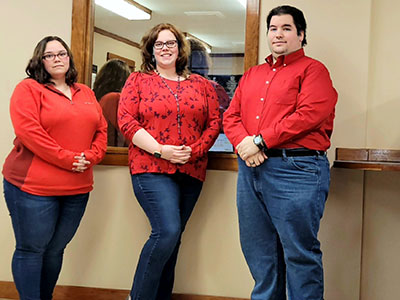 Keene Employees Wearing Tops and Jeans