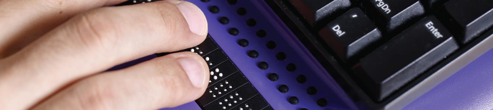 Hand Using Braille Keyboard