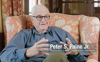 Peter Paine Sitting in a Chair While Talking